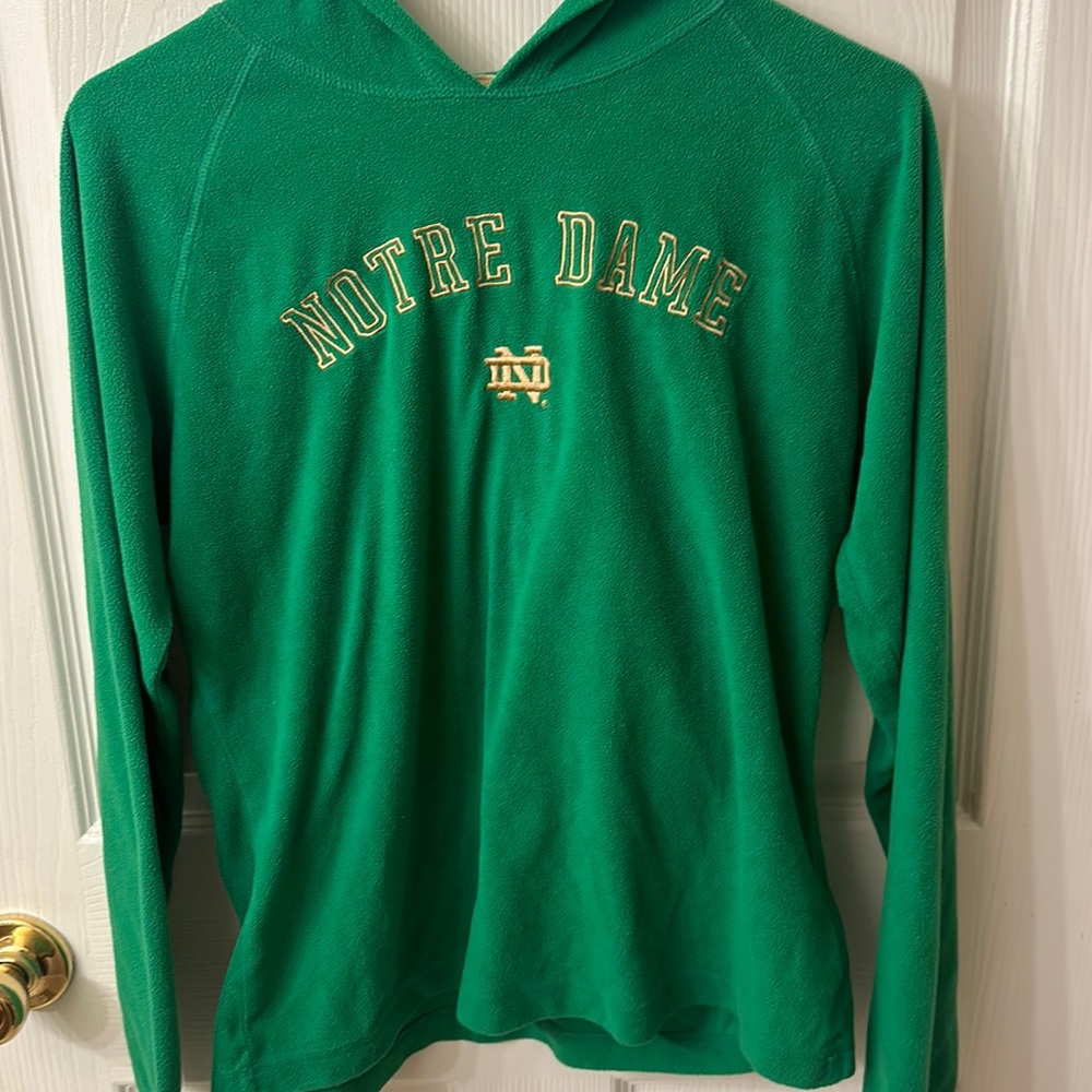 Womens Notre Dame hoodie. Soft fleece material. Green and gold.